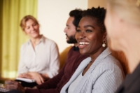 A women smiling in a conference room